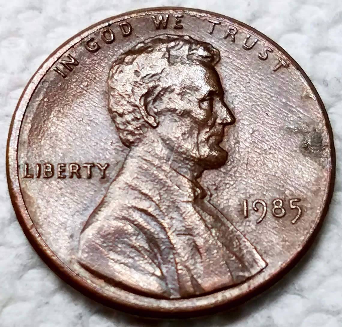 1985-P-Lincoln-Struck-Through-Foreign-Material-On-Reverse?